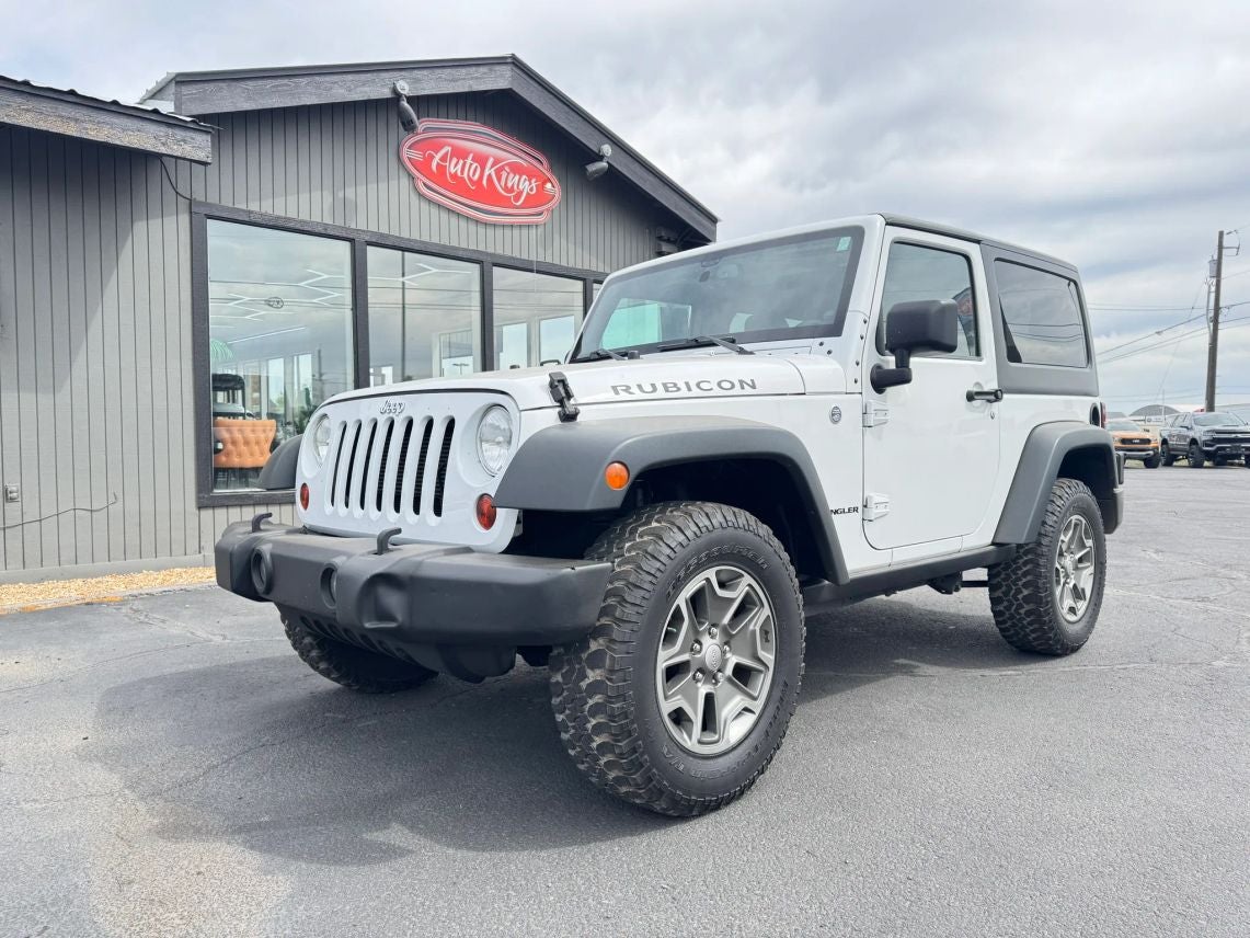 2013 Jeep Wrangler Rubicon in Bright White Clearcoat — front three-quarter view