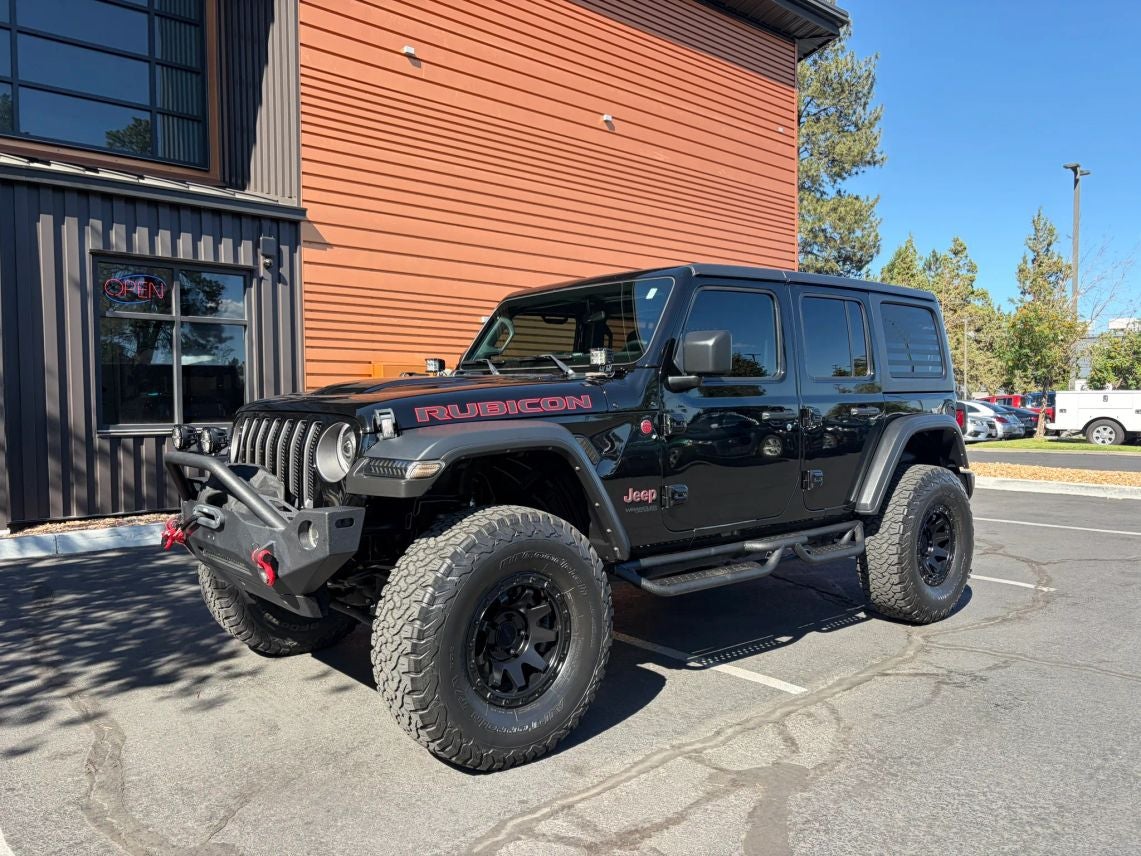 2021 Jeep Wrangler Unlimited Rubicon in Black Clearcoat — front three-quarter view