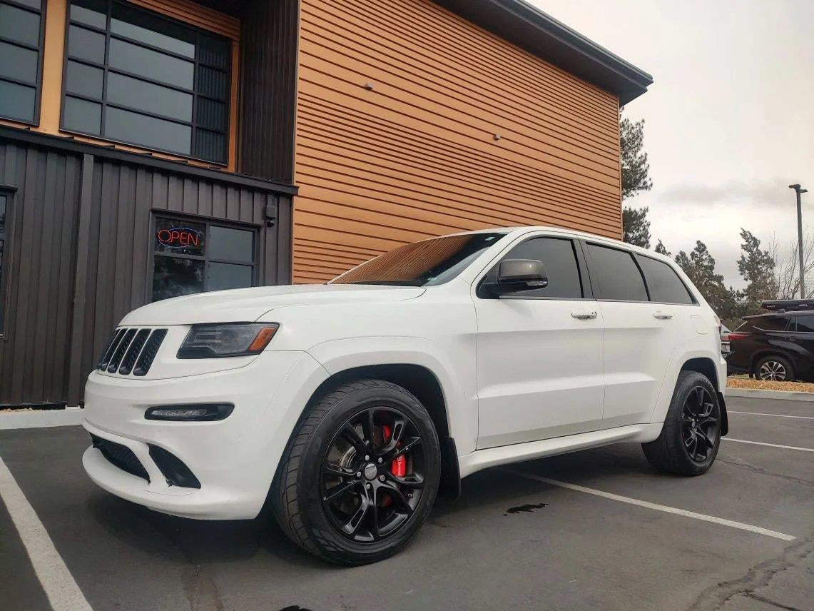 2015 Jeep Grand Cherokee SRT in Brilliant Black Crystal Pearlcoat — front three-quarter view