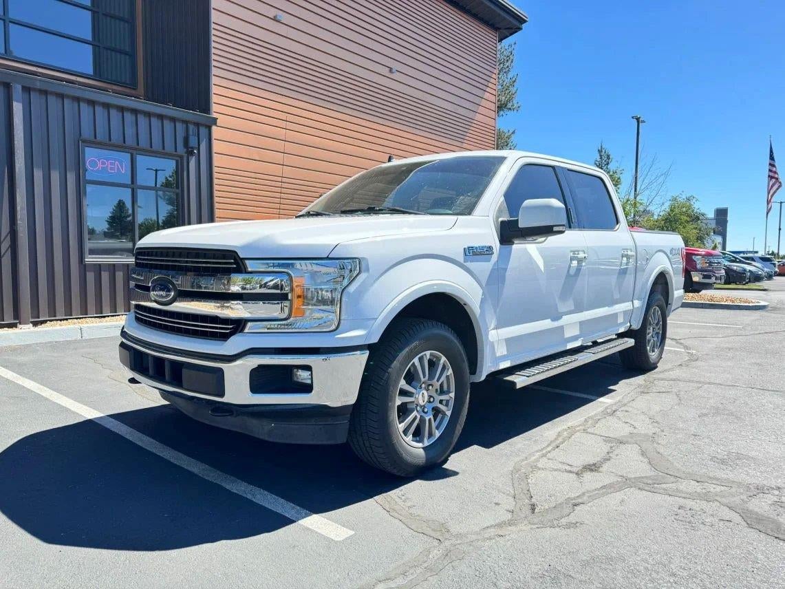 2019 Ford F-150 Lariat in Oxford White — front three-quarter view