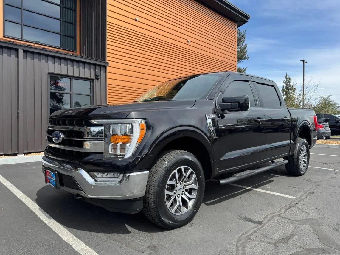 2021 Ford F-150 Lariat in Black Metallic — front three-quarter view