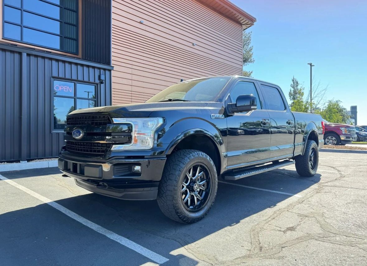 2018 Ford F-150 Lariat in Shadow Black — front three-quarter view