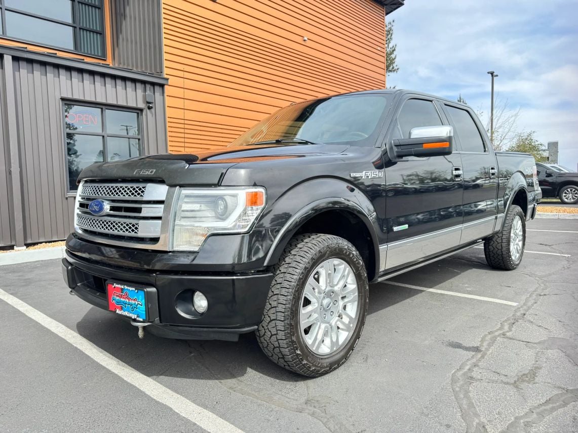 2014 Ford F-150 Platinum in Black — front three-quarter view