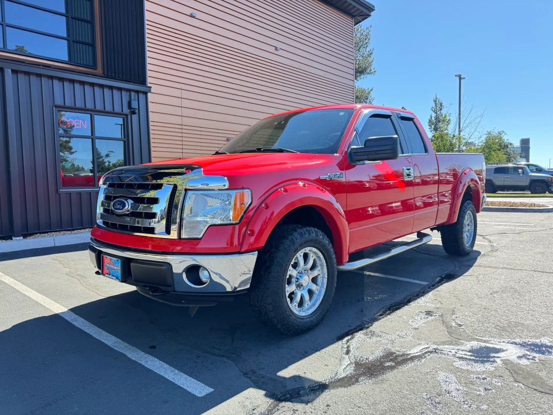 2011 Ford F-150 XLT in Race Red — front three-quarter view