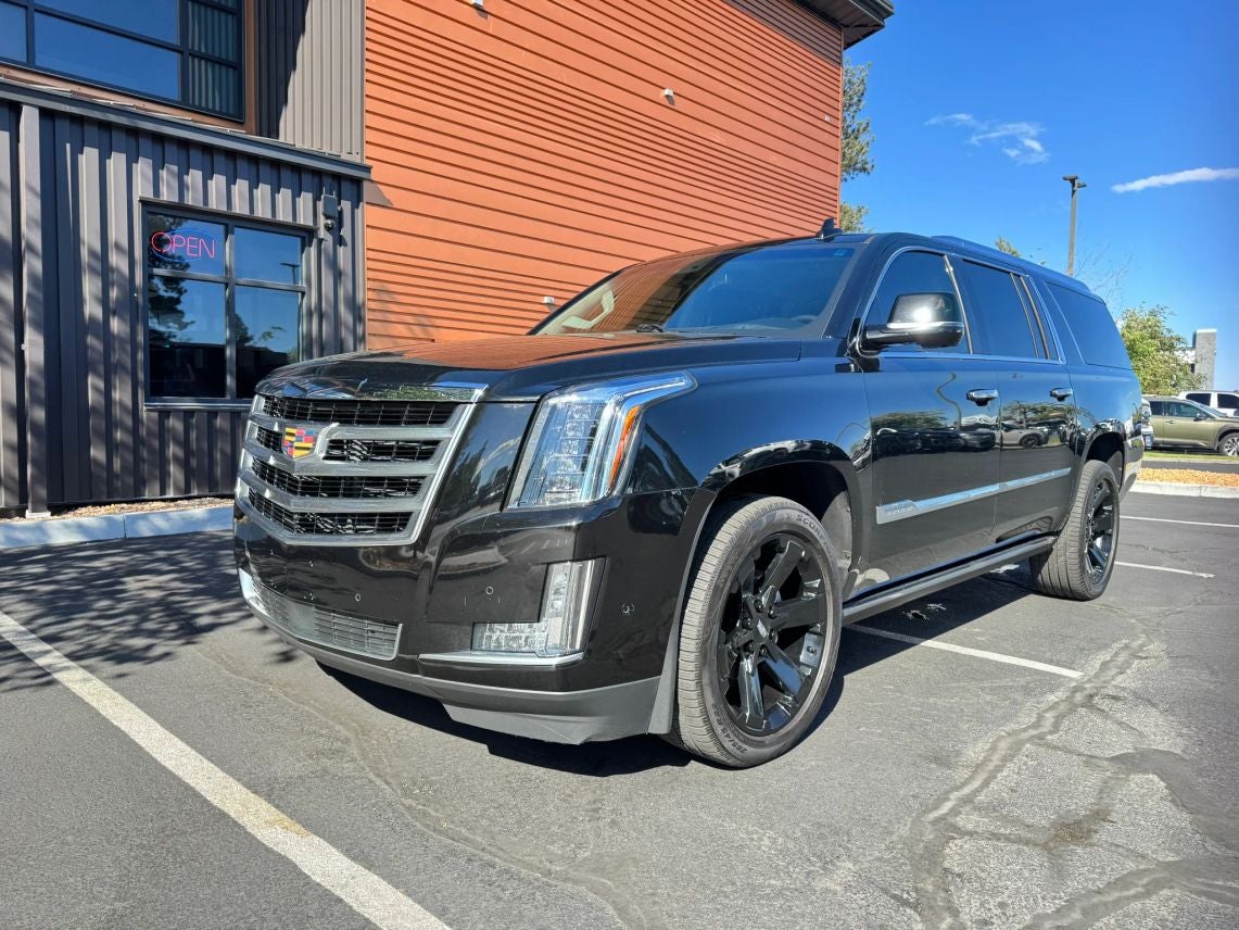 2019 Cadillac Escalade ESV Premium Luxury in Black Raven — front three-quarter view