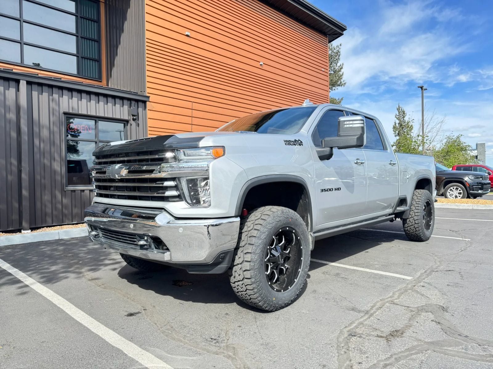 2023 Chevrolet Silverado 3500HD High Country in Silver Ice Metallic — front three-quarter view