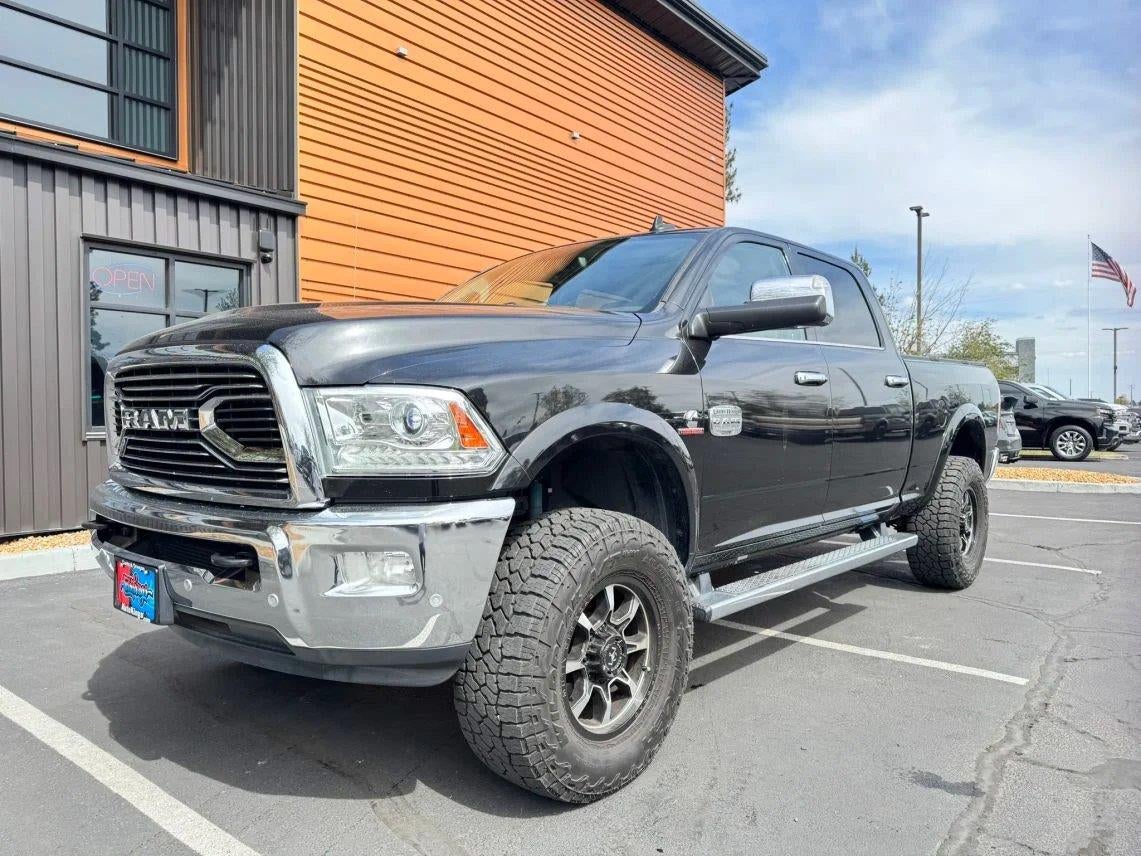 2018 RAM 2500 Laramie Longhorn in Brilliant Black Crystal Pearlcoat — front three-quarter view