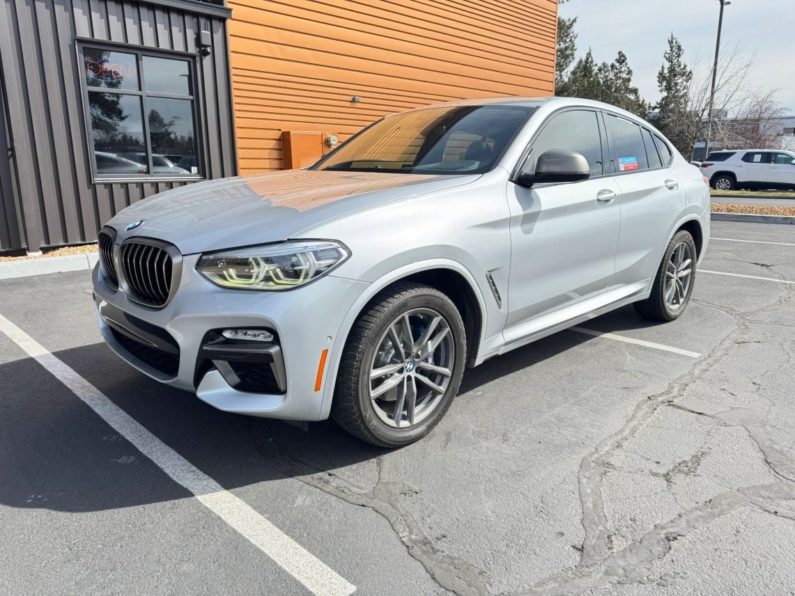 2019 BMW X4 M40i in Glacier Silver Metallic — front three-quarter view