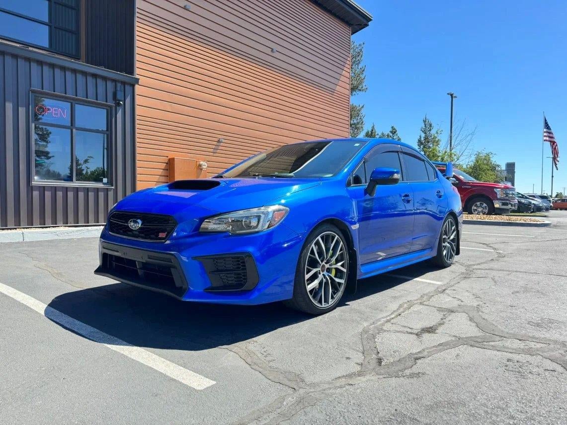 2020 Subaru WRX STi in Wr Blue Pearl — front three-quarter view