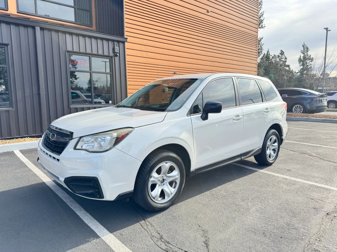 2017 Subaru Forester 2.5i in Crystal White Pearl — front three-quarter view