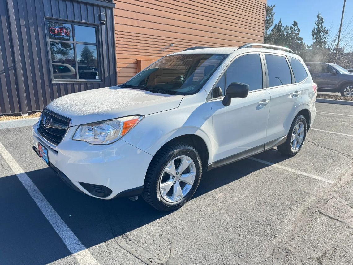 2016 Subaru Forester 2.5i in Crystal White Pearl — front three-quarter view