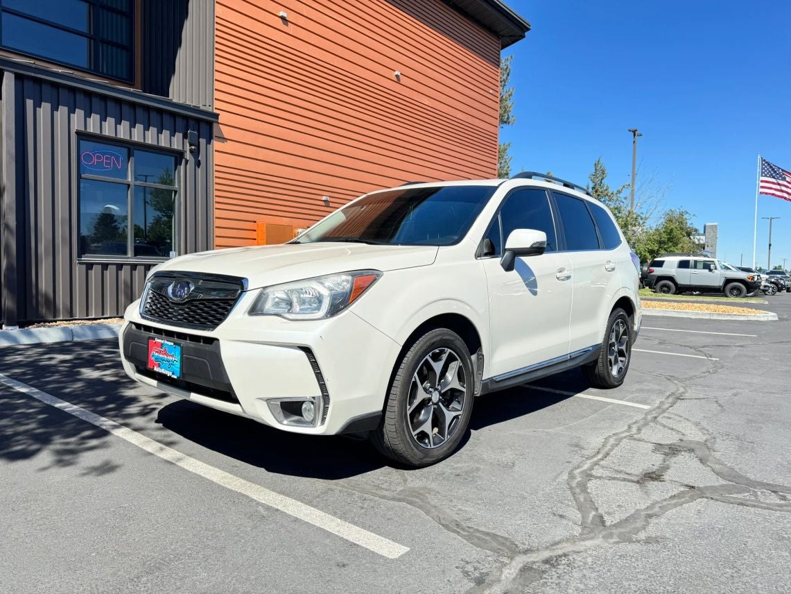 2015 Subaru Forester 2.0XT Touring in Satin White Pearl — front three-quarter view