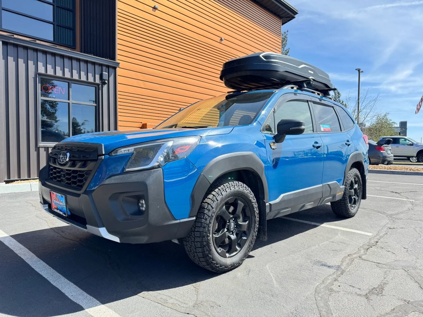 2022 Subaru Forester Wilderness in Geyser Blue — front three-quarter view
