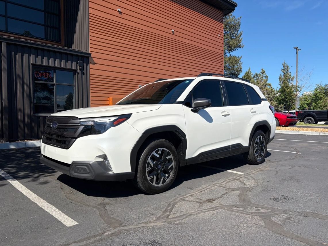 2025 Subaru Forester Premium in Crystal White Pearl — front three-quarter view