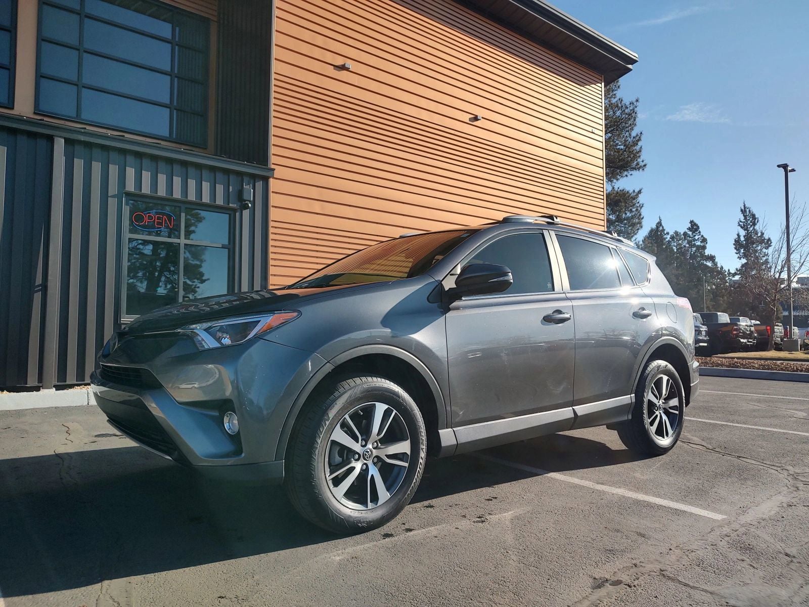 2018 Toyota RAV4 XLE in Magnetic Gray Metallic — front three-quarter view