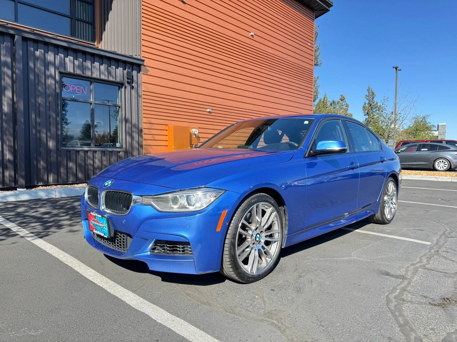 2013 BMW 3 Series 335i xDrive in Estoril Blue Metallic — front three-quarter view