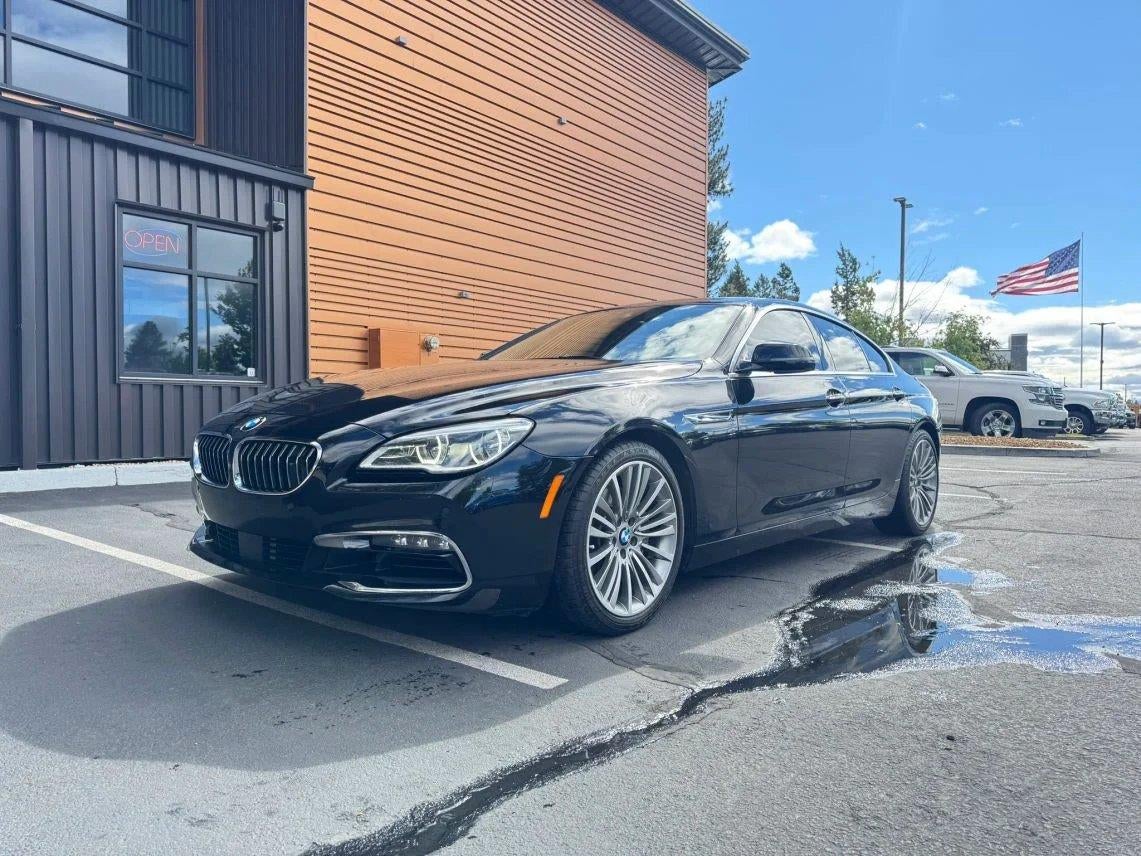 2018 BMW 6 Series 650i xDrive Gran Coupe in Jet Black — front three-quarter view
